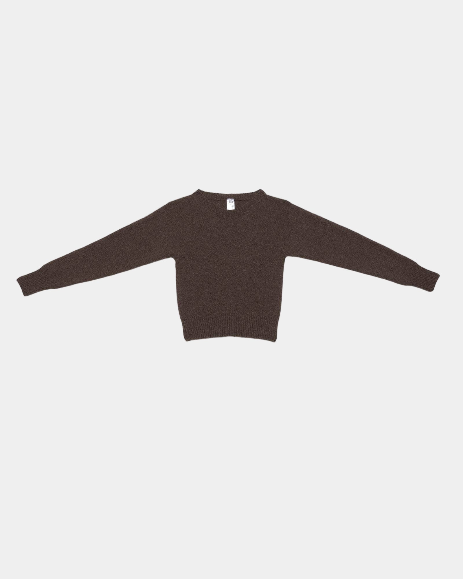 Brown sweater on a light gray background
