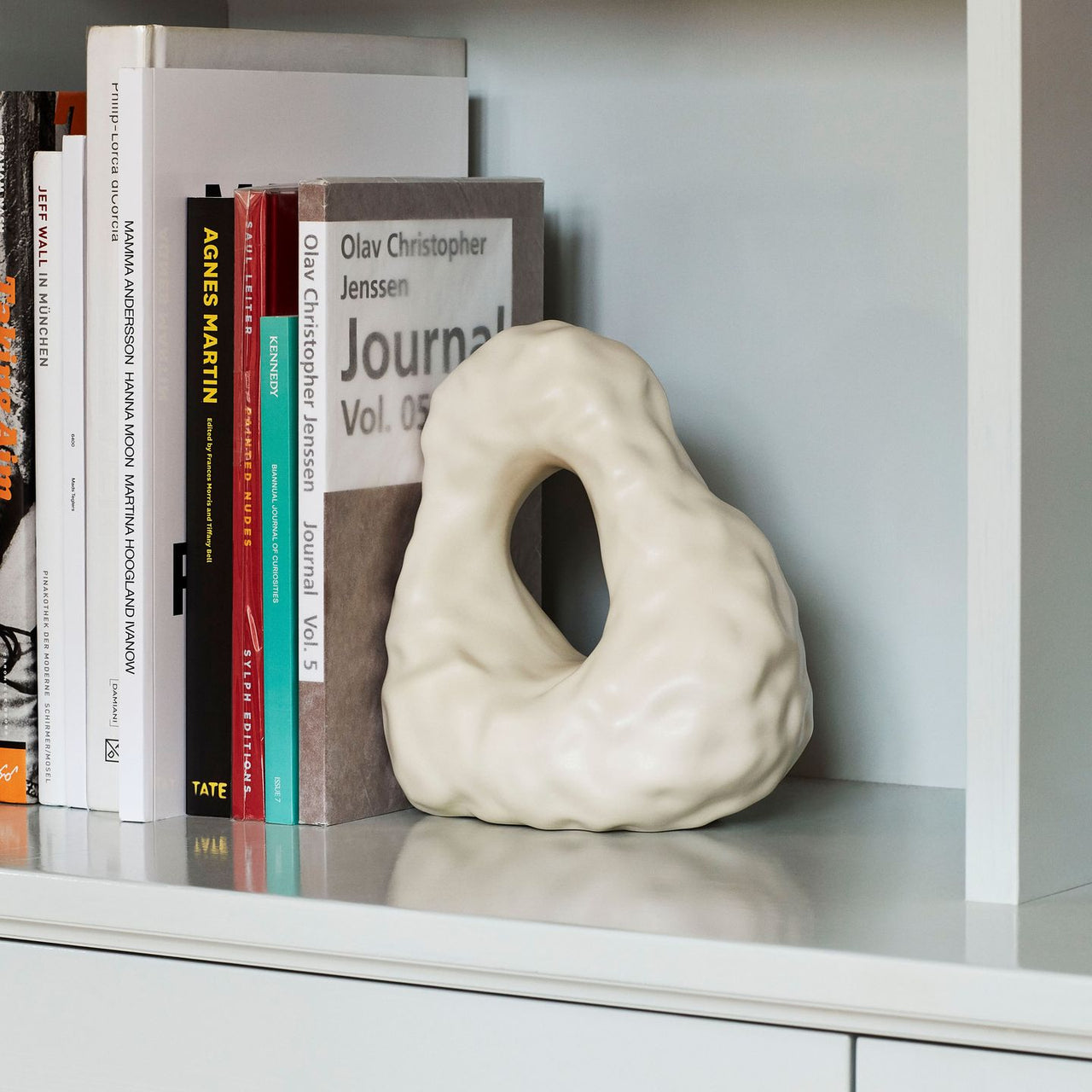 BOULDER BOOKEND BY HAY