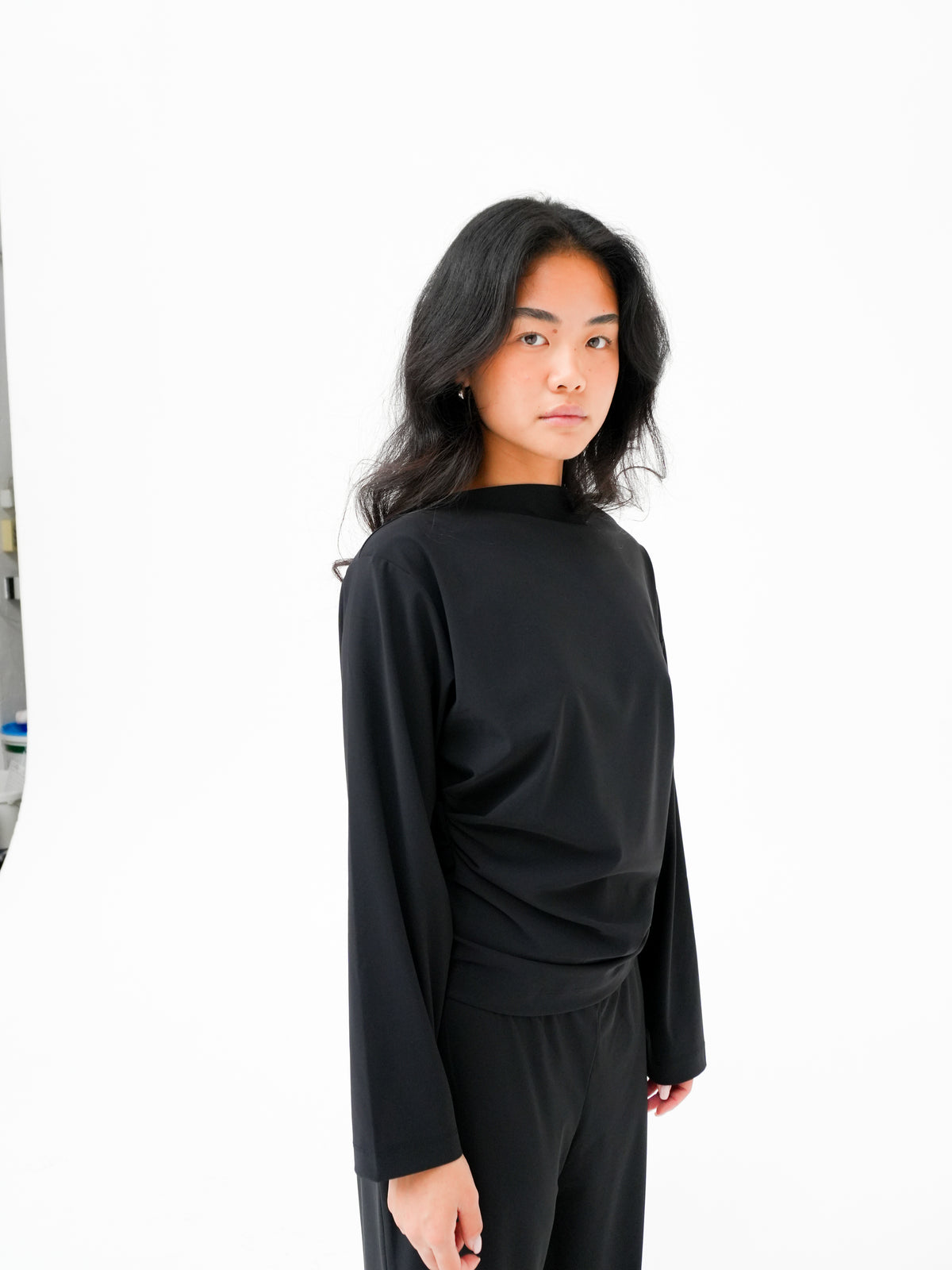 Draped Long Sleeve Top in Black by Reyèm