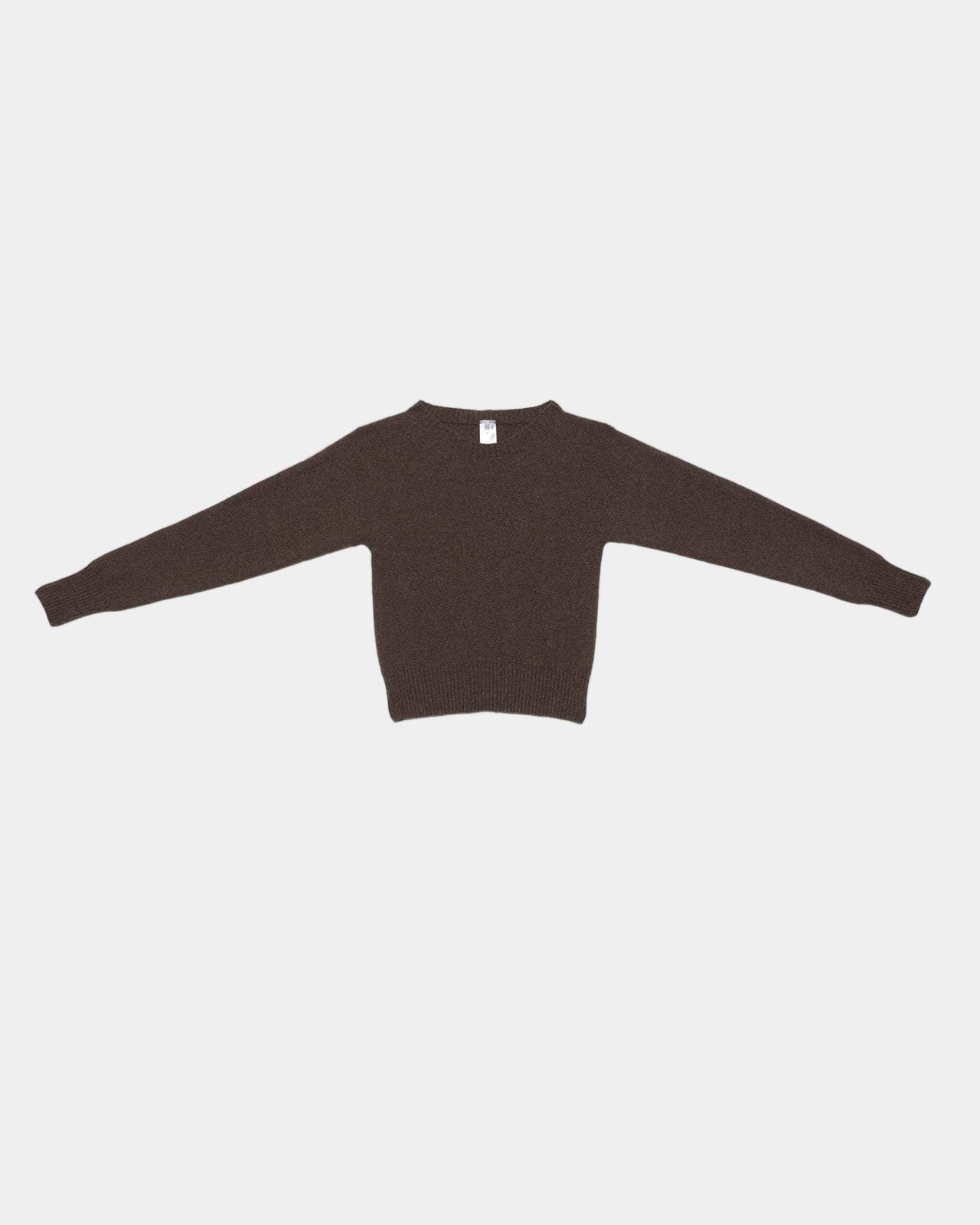 Brown sweater on a light gray background