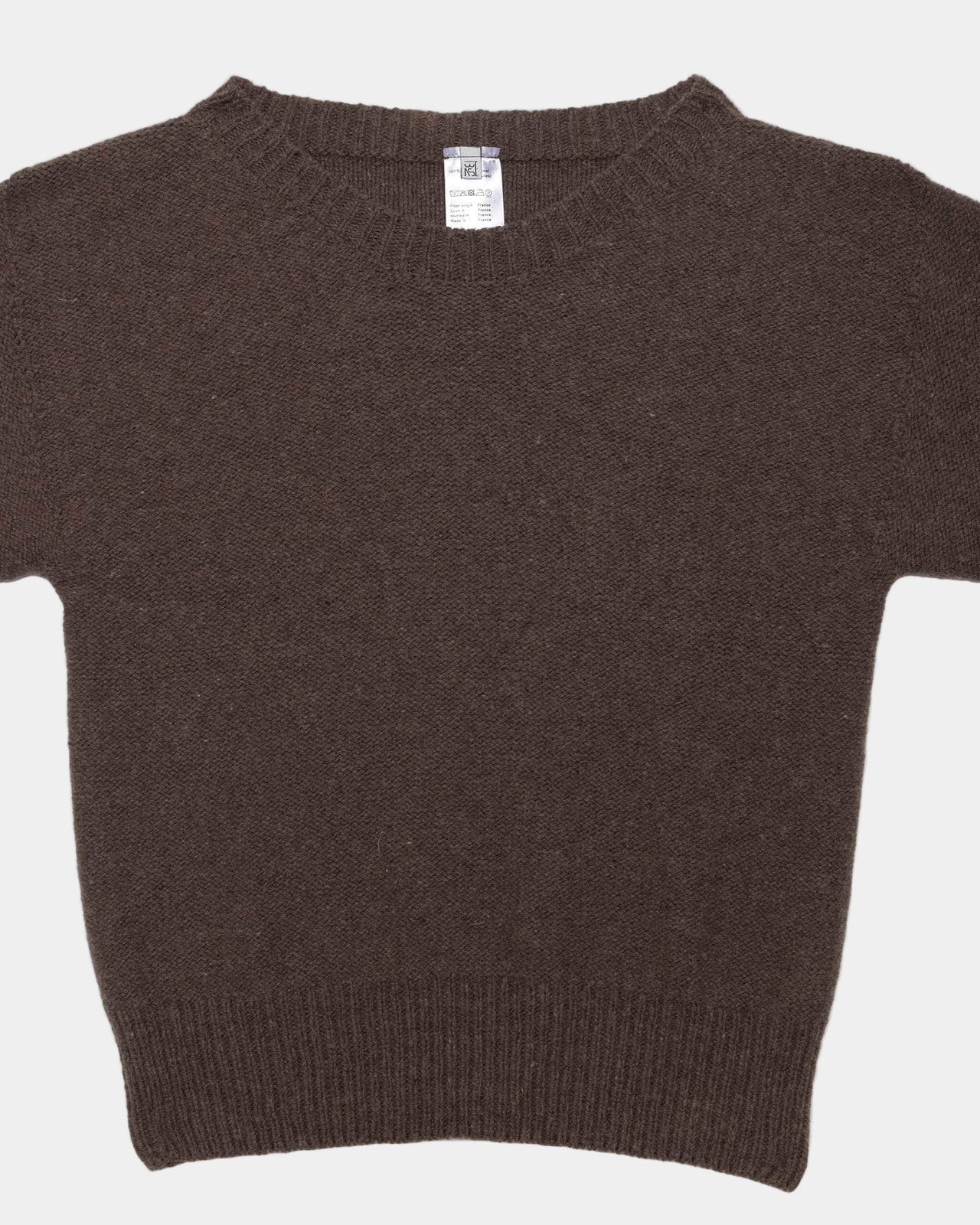 Brown sweater on a light gray background