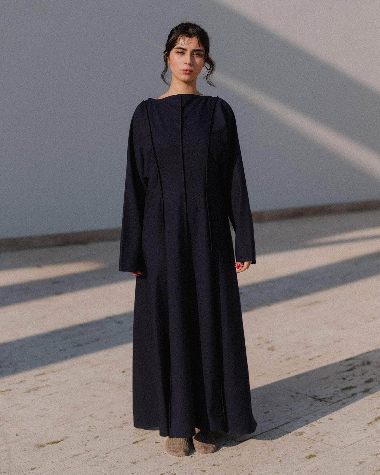 Black dress on a light gray background